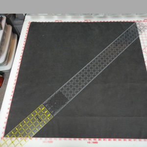 Place a ruler corner to corner and mark diagonal lines.