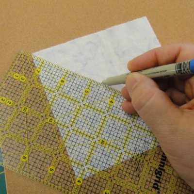 Sandpaper holds fabric steady
