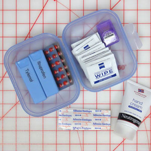 Personal items fit in a small Tupperware clamshell box.