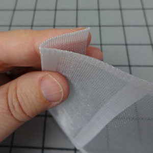 Fold under rod tape on one end.