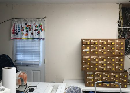 After: Library card catalog wall